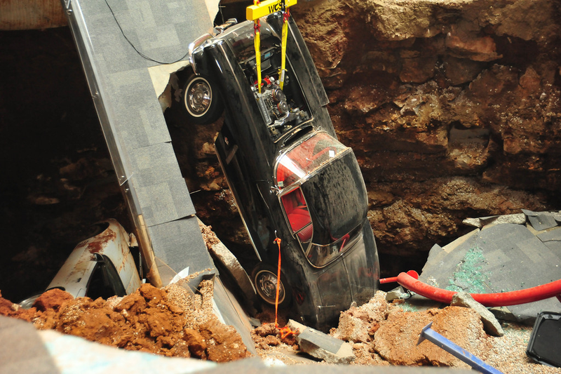 Illustration for article titled Check Out These Amazing Photos From The Corvette Sinkhole Recovery